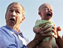bush holding crying baby